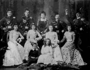 Elizabeth Holt second from left with James Parkinson behind her and little sister May sitting on floor - taken September 8 1902 at the Albert Hall Wakatipu Ball possibly hosted by her father John Holt.